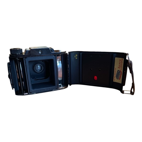 Black Film Photography Camera with Textured Body and Circular Lens - Picture 7 of 11